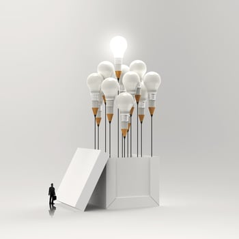 businessman looking at 3d pencil and light bulb concept outside the box as creative and leadership concept